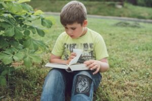 Little boy reading story book